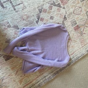 This is a purple sweater, it is size xs, used, and the brand is wild and fable
